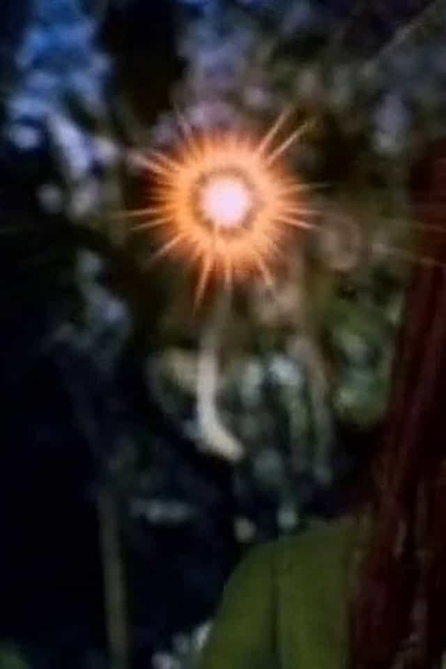 998571